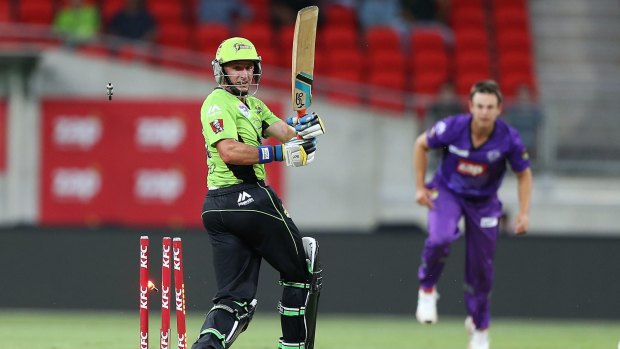 Insult to injury: Mike Hussey is bowled by Evan Gulbis on Friday night.