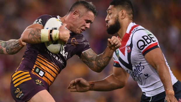 Brisbane skipper Corey Parker takes on the Roosters defensive line at Suncorp Stadium on Thursday night.