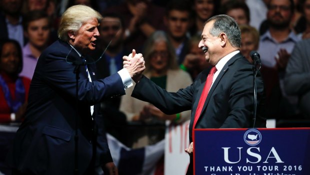 President-elect Donald Trump thanks Andrew Liveris at a Michigan rally on Friday.