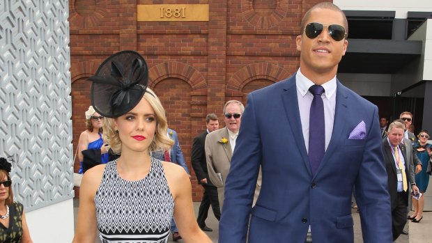 High profile: Louise Pillidge and Blake Garvey make their first official appearance as a couple at the 2014 Melbourne Cup. 