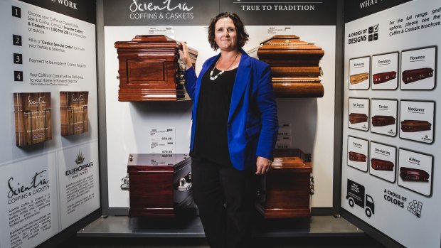 Melanie Greenhalgh with the coffins for sale at Costco. Her choice is 'The Richmond'.