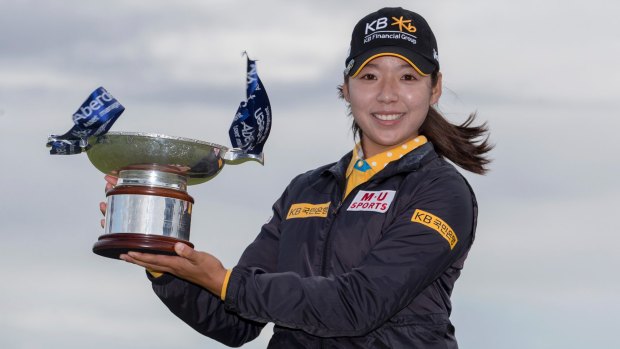 Korea's Mi Hyang Lee poses with the trophy following her win.