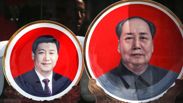 Souvenir plates bearing images of Chinese President Xi Jinping, left, and Mao Zedong  at a shop near Tiananmen Square in Beijing.  