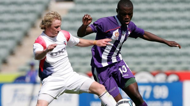 Million Butshiire (right) in action during his days with the Perth Glory youth team.