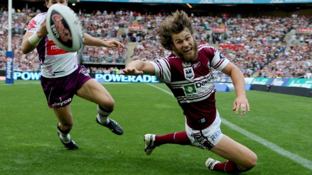 Familiar picture: David Williams reaches for the ball during Manly's 40-0 grand final thrashing of Melbourne in 2008.