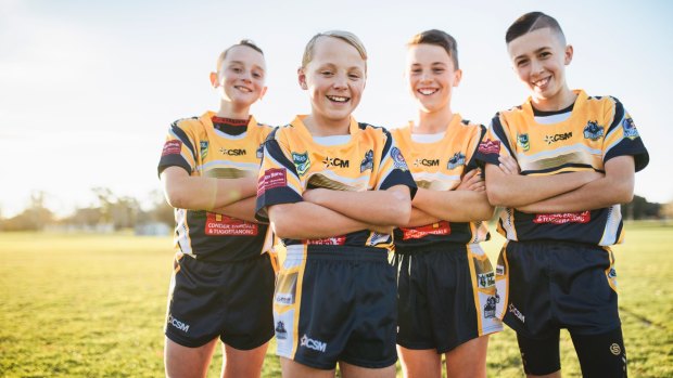 Tuggeranong Buffaloes under-12s players Owen Lewis, Will Purcell, Kai Callaway, and Reece Petrovic are happy to help Eli Chatfield with his fight against cancer.