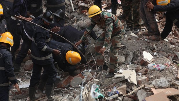 At least 12 people were crushed to death when a five-storey building collapsed in India's financial capital Mumbai on July 25. 