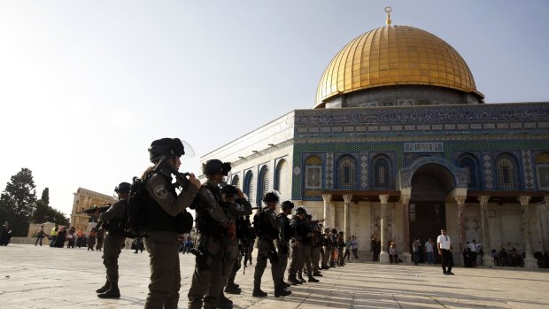 A city of significance to Christians, Muslims and Jews. Israeli border police officers stand near the Dome of the Rock Mosque in Jerusalem's Old City.