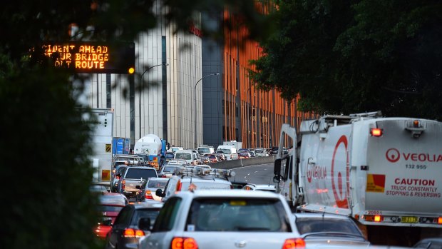 Traffic heading north towards the Sydney Harbour Bridge: the cost of such congestion stretches into billions of dollars every year.
