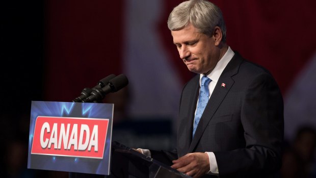 Conservative Leader Stephen Harper pauses while addressing supporters after defeat in Calgary, Alberta, on Monday.