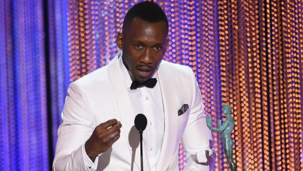 Mahershala Ali accepts the award for outstanding performance by a male actor in a supporting role for <i>Moonlight</i> at the 23rd annual Screen Actors Guild Awards in Los Angeles.