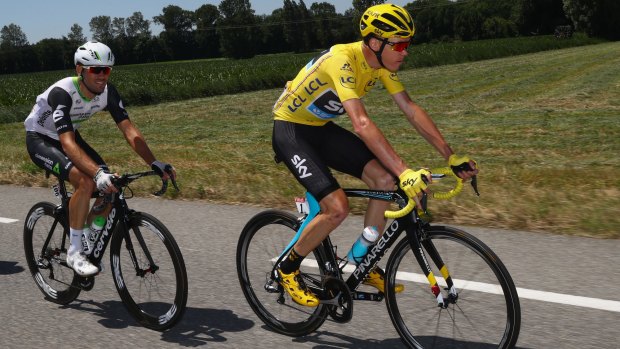 Chris Froome (right) tracked by eventual stage winner Mark Cavendish (left).
