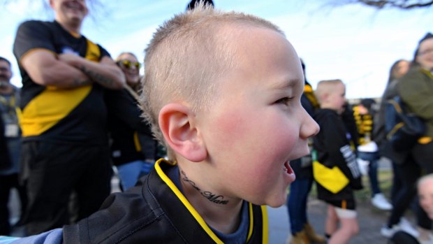 Feeling a little Dusty: Xavier Knabel sports a Dusty haircut and neck tattoo at the grand final parade on Friday.