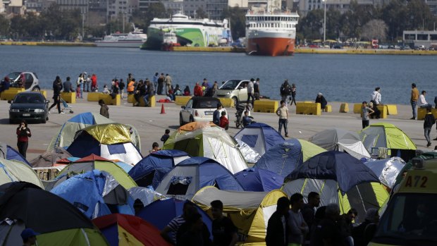 More than 5000 migrants are camped at the Athens port of Piraeus.