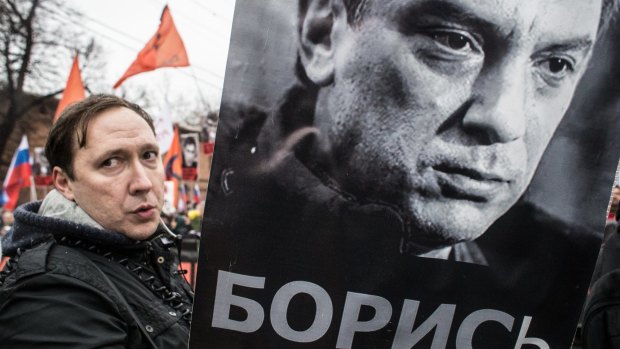 People march in memory of Russian opposition leader and former deputy prime minister Boris Nemtsov in central Moscow.   