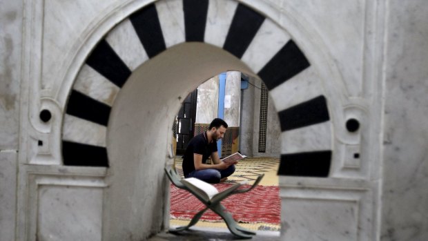 A man reads the Koran during the last week of  Ramadan in Tunis.