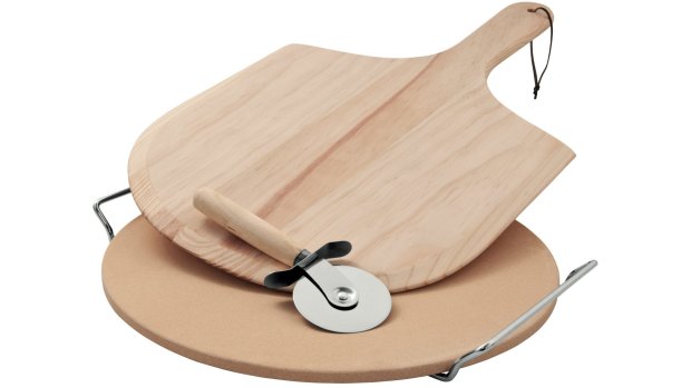 BeefEater pizza stone and spatula with cutting wheel.