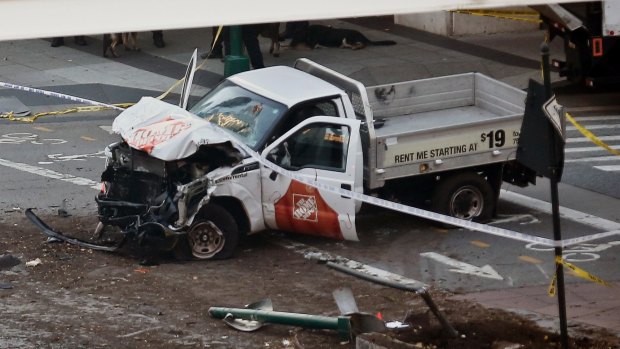 The damaged Home Depot truck came to rest in the bike lane in New York City.
