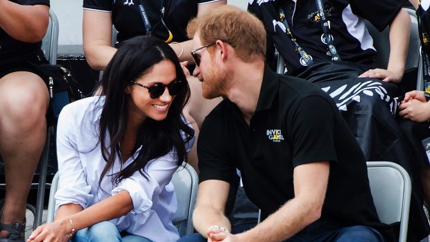 Prince Harry and his girlfriend Meghan Markle attend the wheelchair tennis competition at the Invictus Games in Toronto.
