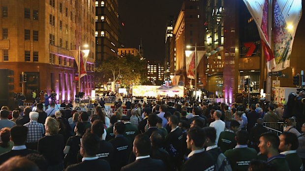 Members of the public look on during the one year service of the Lindt Cafe Siege.