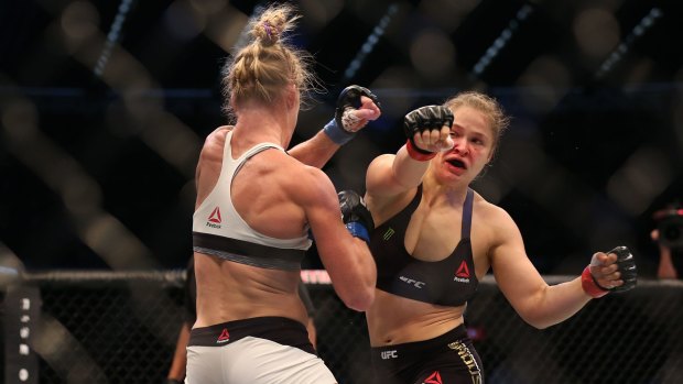 Ronda Rousey and Holly Holm  compete in their UFC women's bantamweight championship bout.