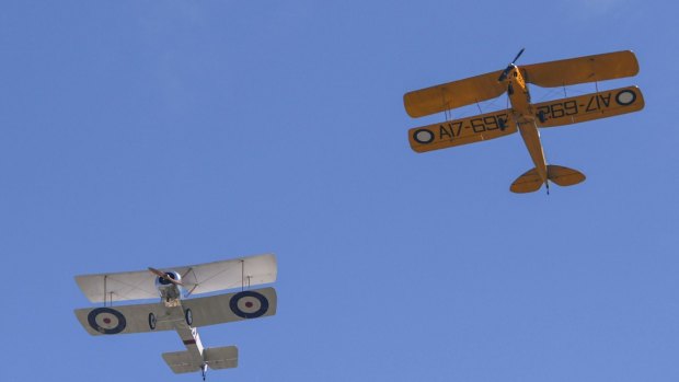 A fly-past of Sopwith Pup and Tiger Moth aircraft.
