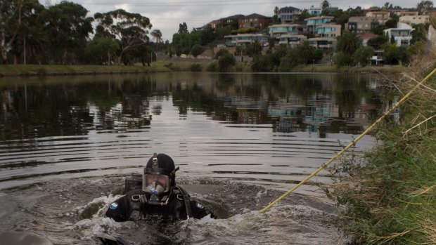Police search and rescue divers scour the Maribyrnong river