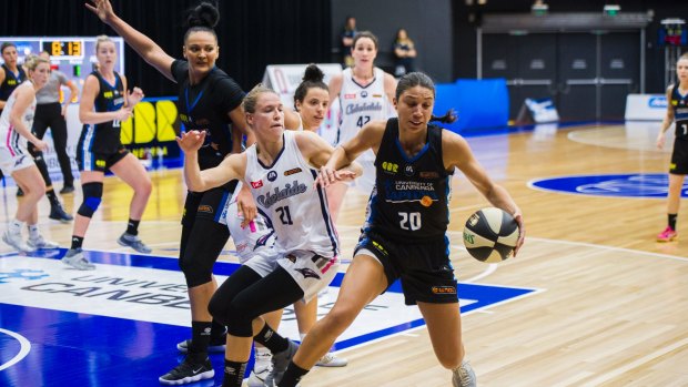 Canberra's Chevannah Paalvast gets round Adelaide's Natalie Novosel.