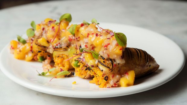 Squid stuffed with spiced chorizo paella and topped with mango salsa.