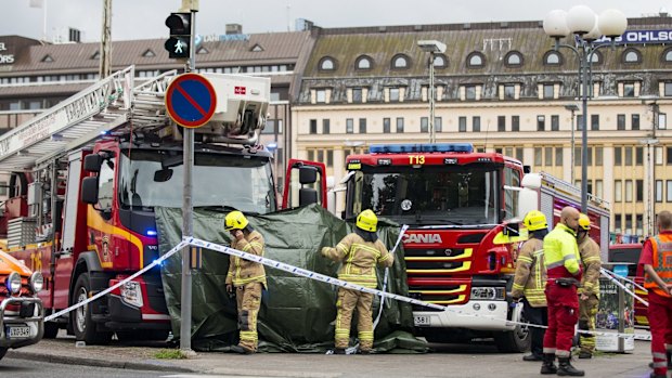 Rescue services attend the scene after the attack.