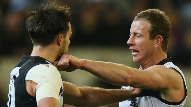 Here's one for you: Geelong's Steve Johnson locks horns with Nathan Brown of the Magpies.