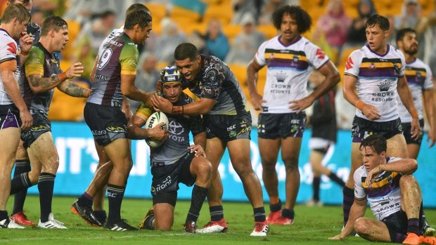 All class: The Cowboys celebrate Johnathan Thurston's try on Frriday night.