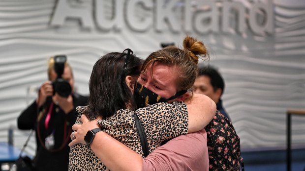 Emotional scenes as passengers arrive at Auckland Airport on the first trans-Tasman bubble flight.