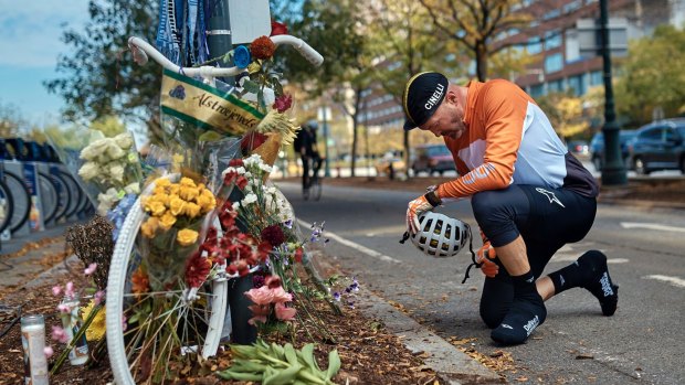 Eric Fleming stops by to express his condolences in front of a bike memorial on the New York path where eight people died.
