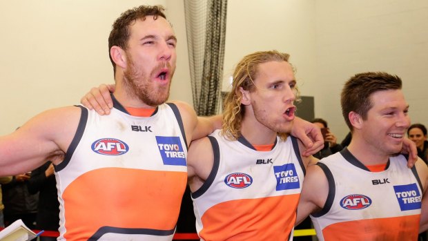 In tune: Shane Mumford and his Giants teammates celebrate their win over Port Adelaide.