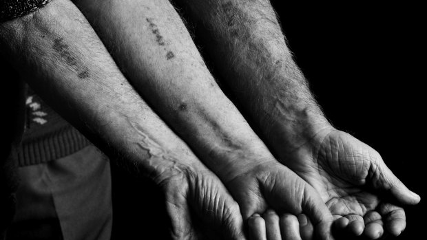 Almost consecutive numbers tattooed on the arms of three prisoners who stood in the same line in Auschwitz.