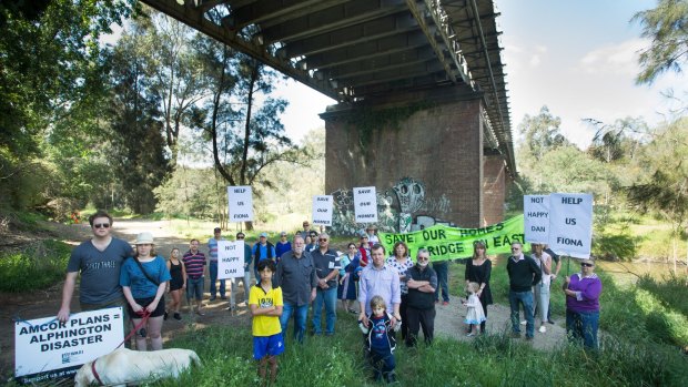 Alphington residents, pictured in October beneath the Chandler Highway bridge, are disappointed in VicRoads final plan for a new $110 six-lane bridge. 