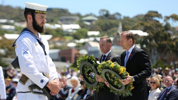 Tribute: Tony Abbott and his New Zealand counterpart John Key lay wreaths at the Anzac Peace Park on Saturday.