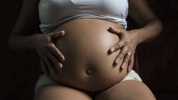 A woman, who is seven months pregnant, is photographed in Recife, Brazil.