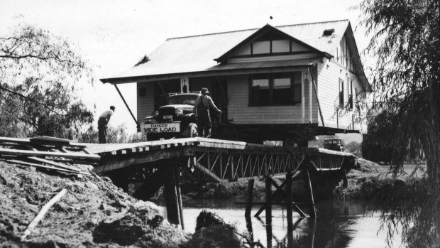 A house being moved from the old township of Tallangatta to the new site in 1954.