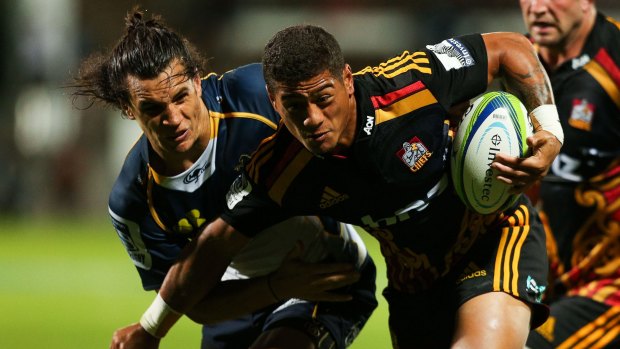 Augustine Pulu of the Chiefs is tackled by Matt Toomua of the Brumbies on Friday.