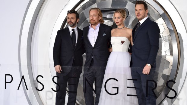 Michael Sheen, from left, director Morten Tyldum, Jennifer Lawrence and Chris Pratt arrive at the Los Angeles premiere of Passengers.