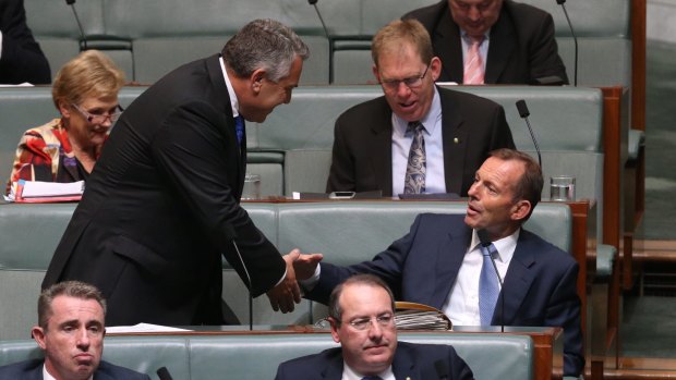 Backbencher Joe Hockey takes his seat with Tony Abbott as Parliament returns.