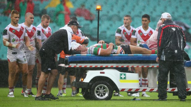 Nervous moments: Sam Burgess is taken from the field on a medicab.