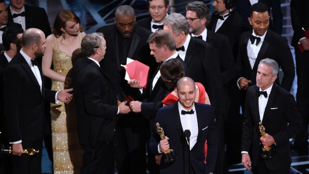 Mayhem on the Oscars stage during the Best Picture announcement error.