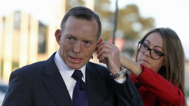 Prime Minister Tony Abbott gets ready for breakfast TV interviews.
