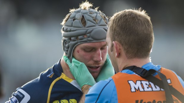 David Pocock receives treatment during Saturday's match.