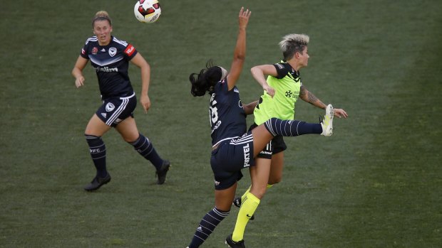 Samantha Johnson of Melbourne Victory and Michelle Heyman of Canberra United collide.
