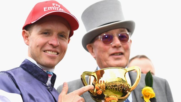 Winning jockey Kerrin McEvoy and owner Lloyd Williams with the Melbourne Cup on Tuesday.