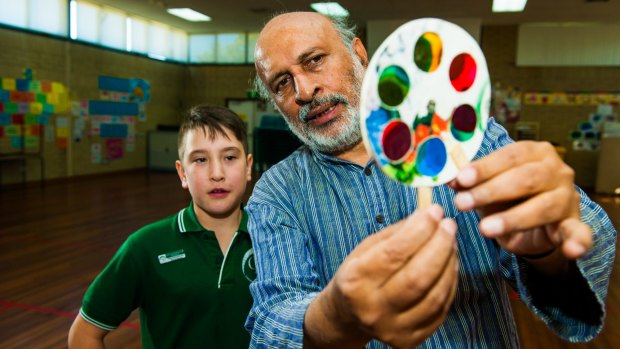 Indian toy maker and science educator Arvind Gupta, visits Charnwood-Dunlop Primary School with year 6 student Marcus Andreatta 11, holding a mini-workshop showing toys made from trash.